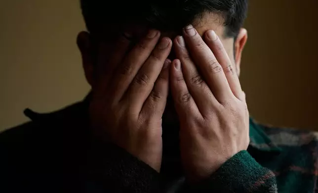 Rohullah R., who did not want his face to be shown or to disclose his last name out of fear of ICE, is photographed at his home in North Highlands, Calif., Friday, Dec. 5, 2025. (AP Photo/Godofredo A. Vásquez)