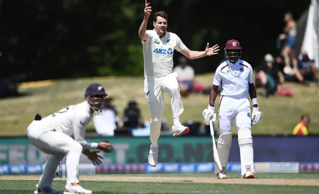 New Zealand's Jacob Duffy, center, celebrates the wicket of West Indies player Shai Hope on Day 5 of their cricket test match in Christchurch, New Zealand, Saturday, Dec. 6, 2025. (Chris Symes/Photosport via AP)