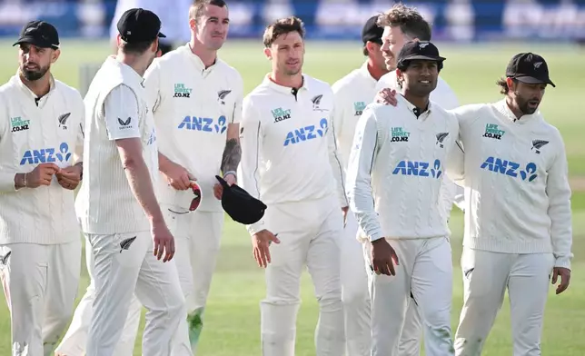 New Zealand players walk off at the end of Day 5 of their cricket test match against the West Indies in Christchurch, New Zealand, Saturday, Dec. 6, 2025. (Andrew Cornaga/Photosport via AP)