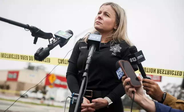 Public Information Officer Heather Brent with the San Joaquin Sheriff's Department speaks with members of the press at Thornton Blvd. and Lucile Ave., near the site of Saturday's shooting at a banquet hall in Stockton, Calif., Sunday, Nov. 30, 2025. (Brontë Wittpenn/San Francisco Chronicle via AP)