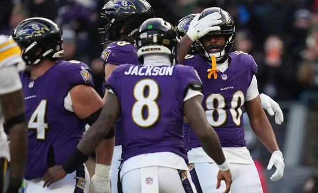 Baltimore Ravens tight end Isaiah Likely (80) celebrates after a touchdown during the second half of an NFL football game against the Pittsburgh Steelers, Sunday, Dec. 7, 2025, in Baltimore. (AP Photo/Stephanie Scarbrough)