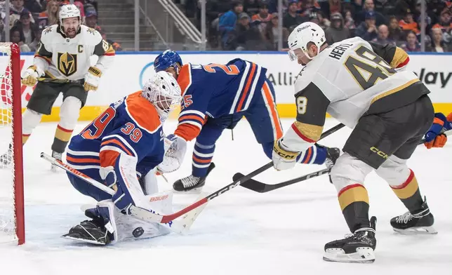 Vegas Golden Knights' Tomas Hertl (48) is stopped by Edmonton Oilers goalie Connor Ingram (39) during third-period NHL hockey game action in Edmonton, Alberta, Sunday, Dec. 21, 2025. (Jason Franson/The Canadian Press via AP)