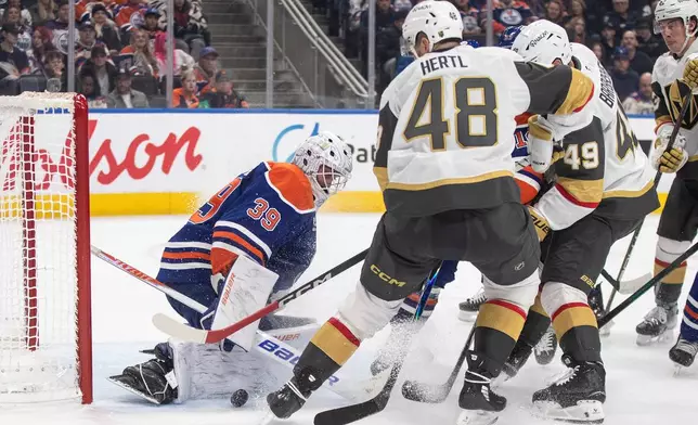 Vegas Golden Knights' Tomas Hertl (48) is stopped by Edmonton Oilers goalie Connor Ingram (39) during third-period NHL hockey game action in Edmonton, Alberta, Sunday, Dec. 21, 2025. (Jason Franson/The Canadian Press via AP)