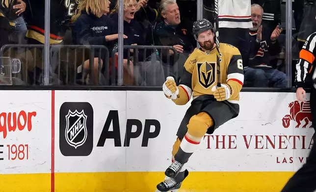 Vegas Golden Knights right wing Mark Stone (61) celebrates after scoring against the San Jose Sharks during the first period of an NHL hockey game Tuesday, Dec. 23, 2025, in Las Vegas. (AP Photo/Steve Marcus)