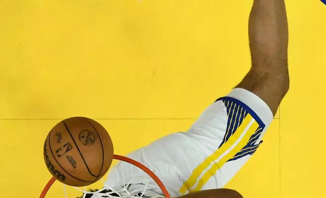 FILE - Golden State Warriors forward Trayce Jackson-Davis shoots against the Dallas Mavericks during the first half of an NBA basketball game, Thursday, Dec. 25, 2025, in San Francisco. (AP Photo/Eakin Howard, File)