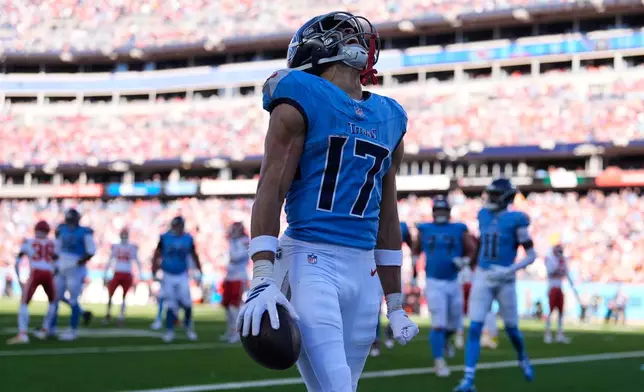 Tennessee Titans wide receiver Chimere Dike celebrates after scoring a touchdown during the first half of an NFL football game against the Kansas City Chiefs, Sunday, Dec. 21, 2025, in Nashville, Tenn. (AP Photo/George Walker IV)