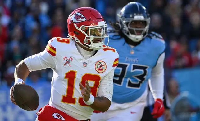 Kansas City Chiefs quarterback Chris Oladokun (19) is chased by Tennessee Titans nose tackle T'Vondre Sweat (93) during the first half of an NFL football game, Sunday, Dec. 21, 2025, in Nashville, Tenn. (AP Photo/John Amis)