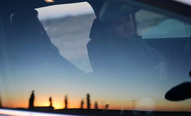 Former Chinese official Li Chuanliang sits in his car as he drives between buildings in the Mayflower Church community, Jan. 18, 2025, in Midland, Texas. (AP Photo/Rebecca Blackwell)