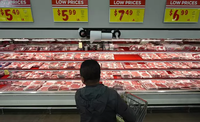 Former Chinese official Li Chuanliang shops for meat at a supermarket in Midland, Texas, Jan. 20, 2025. (AP Photo/Rebecca Blackwell)