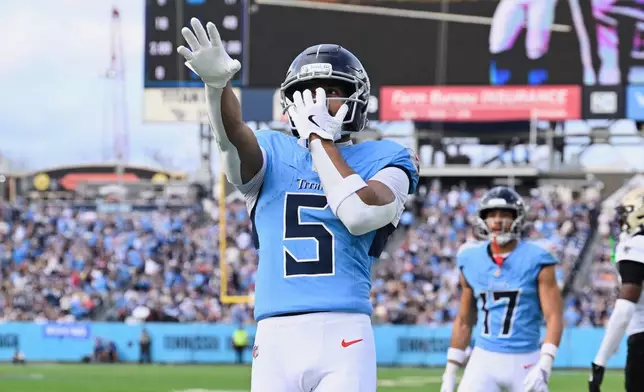 Tennessee Titans wide receiver Elic Ayomanor (5) celebrates his touchdown reception against the New Orleans Saints in the first half of an NFL football game, Sunday, Dec. 28, 2025, in Nashville, Tenn. (AP Photo/John Amis)