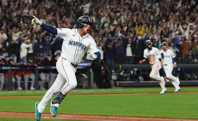 FILE - Seattle Mariners' Jorge Polanco reacts after hitting the game-winning RBI-single for J.P. Crawford to score during the 15th inning in Game 5 of baseball's American League Division Series against the Detroit Tigers, Friday, Oct. 10, 2025, in Seattle. (AP Photo/Lindsey Wasson, File)