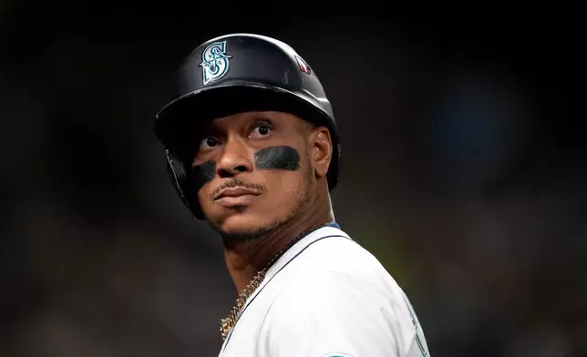 FILE - Seattle Mariners' Jorge Polanco walks to the dugout after a fly out against the Toronto Blue Jays during the fourth inning in Game 4 of baseball's American League Championship Series, in Seattle, Oct. 16, 2025. (AP Photo/Lindsey Wasson, File)