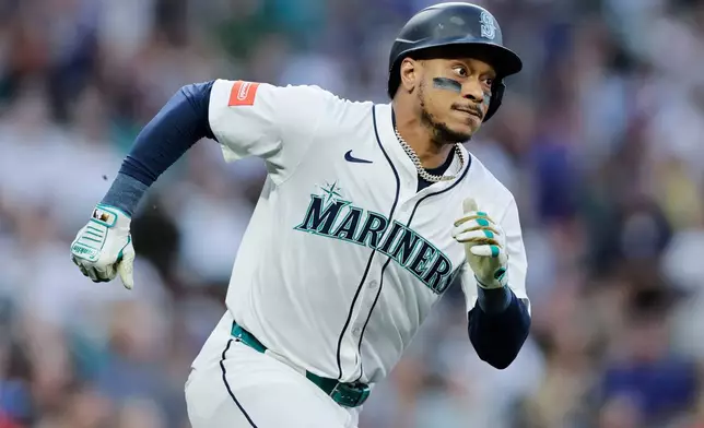 FILE - Seattle Mariners' Jorge Polanco runs on his two-RBI double against the Los Angeles Angels during the first inning of a baseball game Saturday, Sept. 13, 2025, in Seattle. (AP Photo/John Froschauer, File)