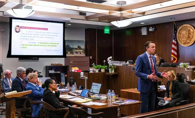 Attorneys listen as Daniel Dutko gives his closing arguments in the wrongful death lawsuit by the family of pitcher Tyler Skaggs against the Los Angeles Angels in Orange County Superior Court in Santa Ana, Calif., Monday, Dec. 15, 2025. (Paul Bersebach/The Orange County Register via AP, Pool)