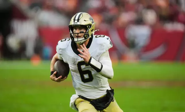 New Orleans Saints quarterback Tyler Shough (6) carries for a touchdown against the Tampa Bay Buccaneers in the second half of an NFL football game, Sunday, Dec. 7, 2025, in Tampa, Fla. (AP Photo/Chris O'Meara)