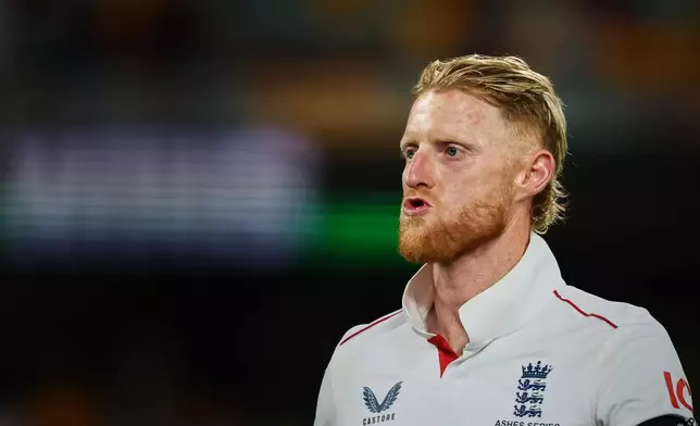 England's captain Ben Stokes leaves the field after lost the second Ashes cricket test match between Australia and England in Brisbane, Sunday, Dec. 7, 2025.. (AP Photo/Tertius Pickard)