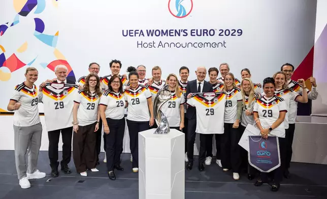 The German delegation celebrates during the announcement ceremony for the host country of the UEFA Women's EURO 2029 in Nyon, Switzerland, Wednesday, Dec. 3, 2025. (Cyril Zingaro/Keystone via AP)