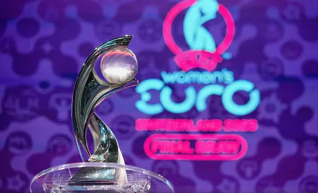 FILE - The tournament trophy is on display at the end of the UEFA Euro 2025 European women's soccer championship final draw at the Swiss Tech Convention Centre in Lausanne, Switzerland, Monday, Dec. 16, 2024. (AP Photo/Laurent Cipriani, File)