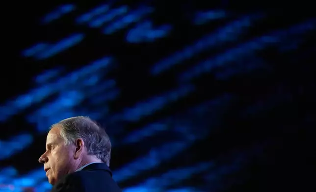 Former Sen. Doug Jones, D-Ala., and gubernatorial candidate speaks during an event Friday, Dec. 12, 2025, in Birmingham, Ala. (AP Photo/Brynn Anderson)