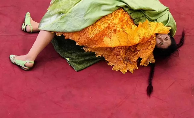 Fernanda Romero wrestles during a ticketed wrestling show in El Alto, Bolivia, Saturday, May 3, 2025. (AP Photo/Juan Karita)