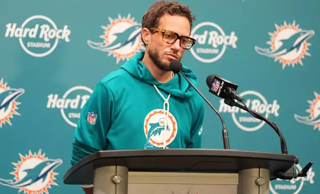Miami Dolphins head coach Mike McDaniel ponders a question at news conference following a loss to the Cincinnati Bengals in an NFL football game, Sunday, Dec. 21, 2025, in Miami Gardens, Fla. (AP Photo/Rebecca Blackwell)