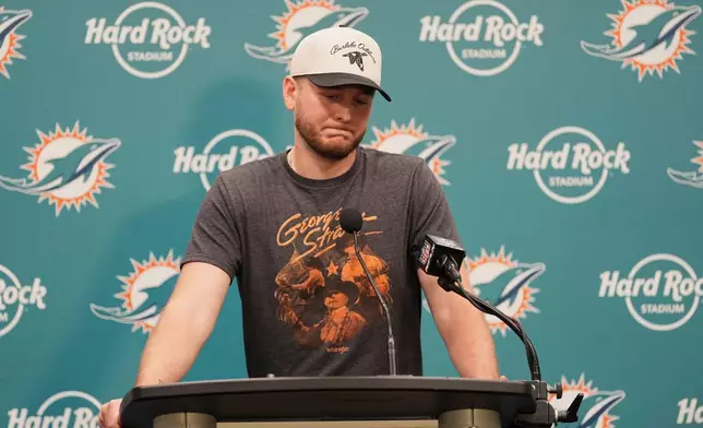 Miami Dolphins quarterback Quinn Ewers pauses during a news conference following a loss to the Cincinnati Bengals in an NFL football game, Sunday, Dec. 21, 2025, in Miami Gardens, Fla. (AP Photo/Rebecca Blackwell)