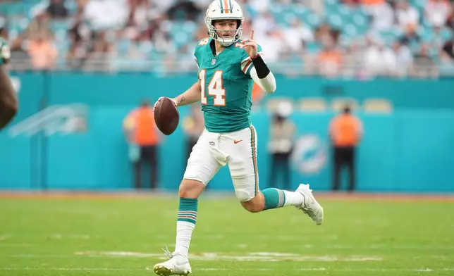 Miami Dolphins quarterback Quinn Ewers looks to pass during the second half of an NFL football game against the Cincinnati Bengals, Sunday, Dec. 21, 2025, in Miami Gardens, Fla. (AP Photo/Rebecca Blackwell)