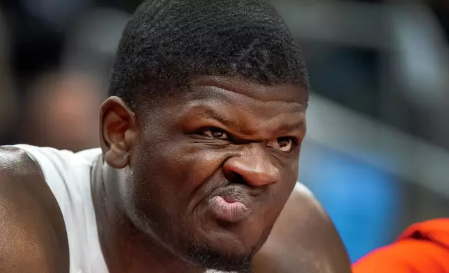 Toronto Raptors centre Mo Bamba makes a face as he watches from the bench during first half NBA action against the Orlando Magic in Toronto on Monday December 29, 2025. (Frank Gunn/The Canadian Press via AP)