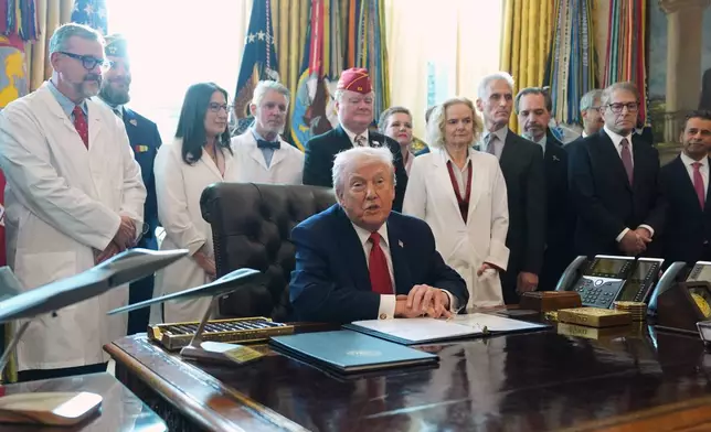 President Donald Trump speaks during an executive order signing in the Oval Office of the White House, Thursday, Dec. 18, 2025, in Washington. (AP Photo/Evan Vucci)