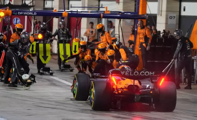 McLaren driver Lando Norris of Britain enters the box in the pitlane during the Qatar Formula One Grand Prix in Lusail, Qatar, Sunday, Nov. 30, 2025.(AP Photo/Altaf Qadri, Pool)