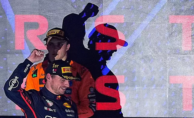 Red Bull driver Max Verstappen of the Netherlands celebrates winning the Qatar Formula One Grand Prix, in Lusail, Qatar, Sunday, Nov. 30, 2025.(AP Photo/Fatima Shbair)