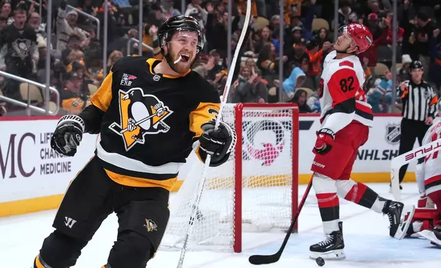 Pittsburgh Penguins' Anthony Mantha (39) celebrates his second goal of the game during the second period of an NHL hockey game against the Carolina Hurricanes in Pittsburgh, Tuesday, Dec. 30, 2025. (AP Photo/Gene J. Puskar)