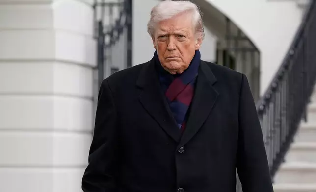 President Donald Trump talks to reporters as he departs from the South Lawn of the White House, Saturday, Dec. 13, 2025, in Washington, en route to Baltimore to attend the Army-Navy football game. (AP Photo/Jose Luis Magana)