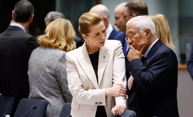 European Council President Antonio Costa, center right, speaks with Denmark's Prime Minister Mette Frederiksen, center left, during a round table meeting at the EU Summit in Brussels, Thursday, Dec. 18, 2025. (AP Photo/Geert Vanden Wijngaert)