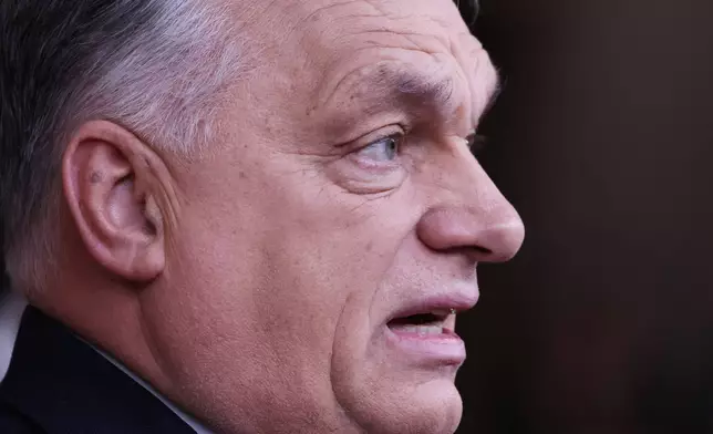 Hungary's Prime Minister Viktor Orban speaks with the media as he arrives for the EU Summit in Brussels, Thursday, Dec. 18, 2025. (AP Photo/Geert Vanden Wijngaert)