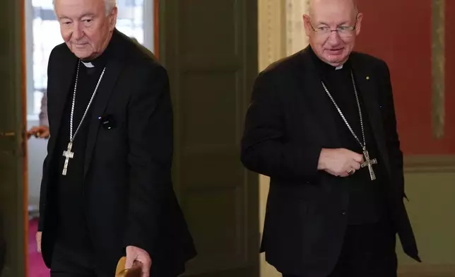 Outgoing archbishop of Westminster Cardinal Vincent Nichols and Bishop Richard Moth arrive for a press conference announcing Bishop Moth as the new Archbishop, replacing Cardinal Nichols as the leader of the Catholic Church in England and Wales, in the Throne Room of Archbishop's House, Westminster, London, Friday, Dec. 19, 2025. (Jonathan Brady/PA via AP)
