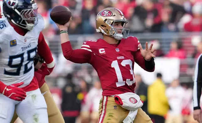 San Francisco 49ers quarterback Brock Purdy (13) looks to throw a pass during the first half of an NFL football game against the Tennessee Titans, Sunday, Dec. 14, 2025, in Santa Clara, Calif. (AP Photo/Godofredo A. Vásquez)