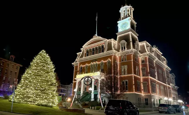 Norwich City Hall is decorated for the annual "Light Up City Hall" event in Norwich, Conn., Friday, Dec. 5, 2025. Scenes from Hallmark movie Sugar Plum Twist were filmed at City Hall. (AP Photo/Susan Haigh)