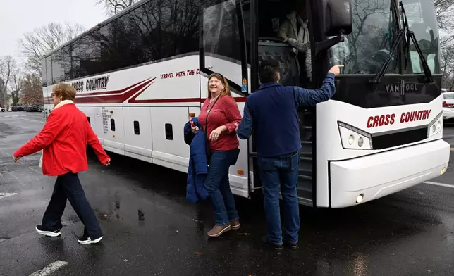 Anita Wilson, a tourist on a weeklong "Hallmark Movie Christmas Tour," arrives in Wethersfield, Conn., Saturday, Dec. 6, 2025, where parts of the Hallmark films "Christmas on Honeysuckle Lane" and "Rediscovering Christmas" were filmed. (AP Photo/Jessica Hill)