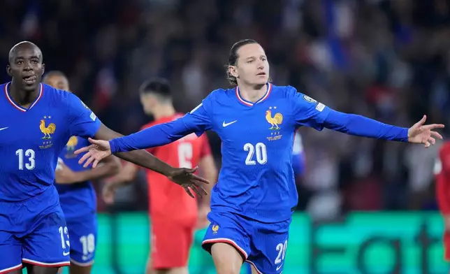 FILE - France's Florian Thauvin celebrates after scoring during a World Cup 2026 Group D qualifying soccer match between France and Azerbaijan in Paris, France, on Friday, Oct. 10, 2025. (AP Photo/Michel Euler, File)