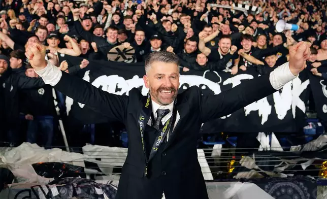 St Mirren manager Stephen Robinson celebrates after the final whistle of the Scottish Premier Sports Cup final against Celtic, in Glasgow, Scotland, Sunday, Dec. 14, 2025. (Jane Barlow/PA via AP)