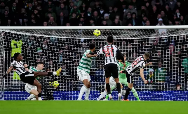 St Mirren's Marcus Fraser, right, scores his side's first goal, during the Scottish Premier Sports Cup final, in Glasgow, Scotland, Sunday, Dec. 14, 2025. (Andrew Milligan/PA via AP)
