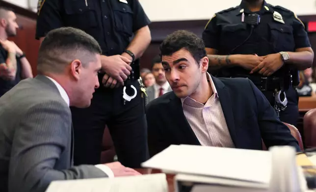 Luigi Mangione appears in Manhattan Criminal Court for an evidence hearing, Tuesday, Dec. 2, 2025, in New York.(Michael M. Santiago/Pool Photo via AP)
