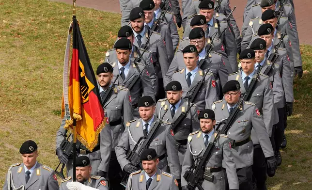FILE - New recruits of the German Army Bundeswehr attend a ceremony to take their oath in front of the North Rhine-Westphalia state parliament in Duesseldorf, Germany, on Sept. 4, 2025. (AP Photo/Martin Meissner, File)