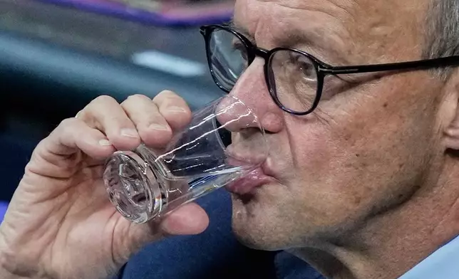 German Chancellor Friedrich Merz attends a meeting of the German Parliament in Berlin, Germany, Friday, Dec.5, 2025. (AP Photo/Ebrahim Noroozi)