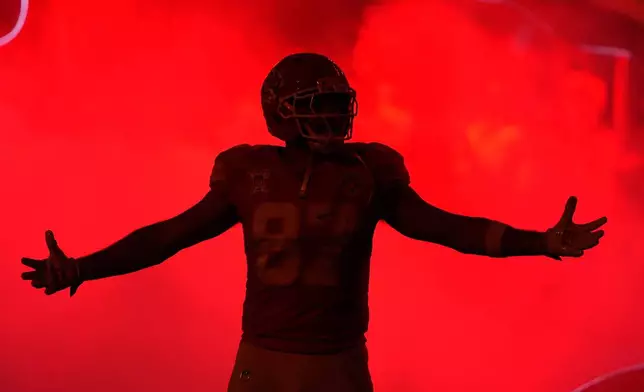 Kansas City Chiefs tight end Travis Kelce is introduced onto the field prior to an NFL football game against the Denver Broncos Thursday, Dec. 25, 2025, in Kansas City, Mo. (AP Photo/Charlie Riedel)