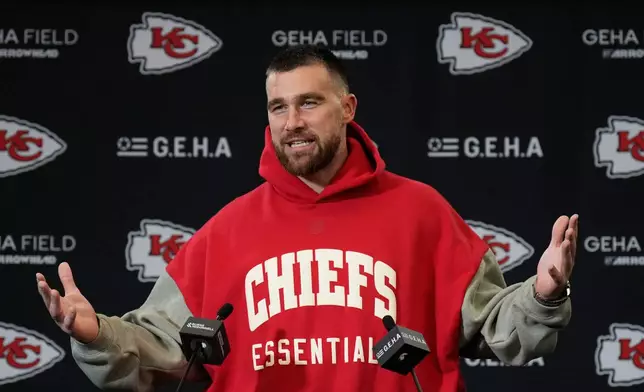 Kansas City Chiefs tight end Travis Kelce talks to reporters following an NFL football game against the Denver Broncos Thursday, Dec. 25, 2025, in Kansas City. (AP Photo/Charlie Riedel)