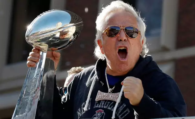 FILE - New England Patriots owner Robert Kraft yells to fans during their victory parade through downtown Boston, Feb. 5, 2019, to celebrate their win over the Los Angeles Rams in Sunday's NFL Super Bowl 53 football game in Atlanta. (AP Photo/Elise Amendola, File)