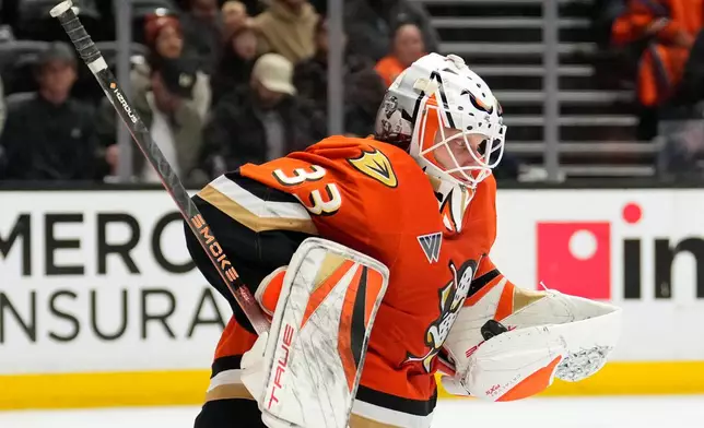 Anaheim Ducks goaltender Ville Husso makes a glove save during the second period of an NHL hockey game against the Utah Mammoth, Wednesday, Dec. 3, 2025, in Anaheim, Calif. (AP Photo/Mark J. Terrill)