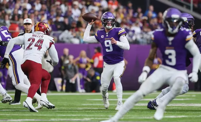 Minnesota Vikings quarterback J.J. McCarthy (9) passes the ball during the first half of an NFL football game against the Washington Commanders, Sunday, Dec. 7, 2025, in Minneapolis. (AP Photo/Matt Krohn)